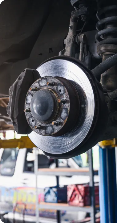 Brake Repair in Ipswich MA At New Meadows Motor Car. Close-up of a brake rotor assembly