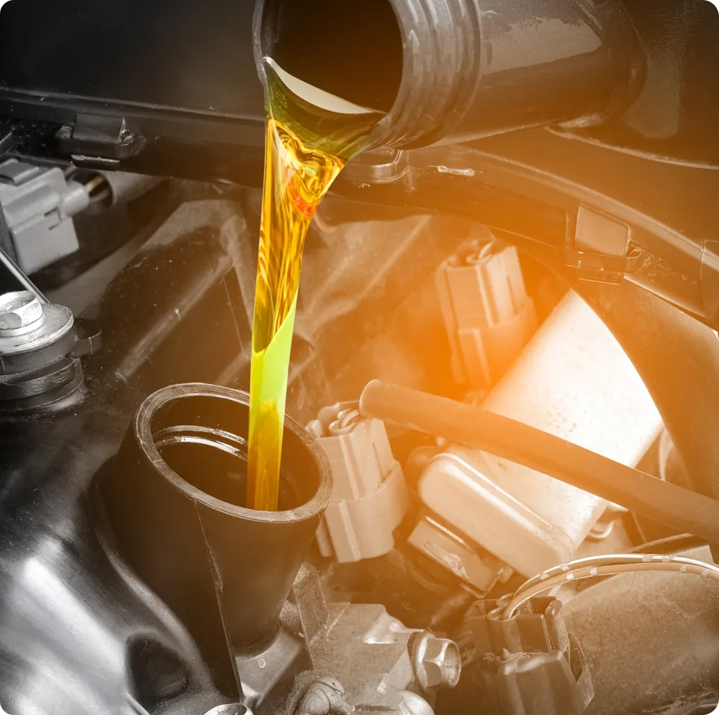 Oil Change Services in Ipswich MA At New Meadows Motor Car. Oil being poured into engine